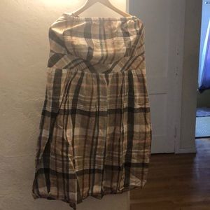 Neutral colored, short, halter dress.